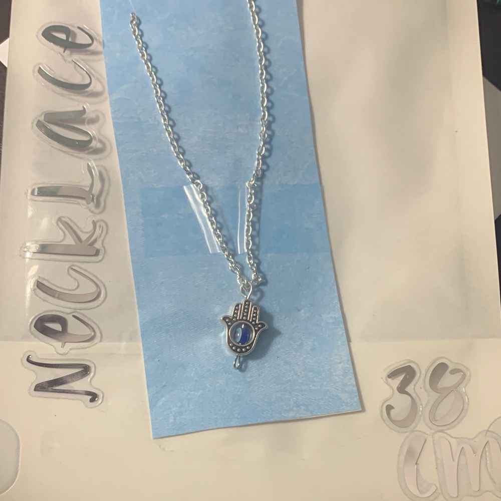Silver Hamsa Necklace with Blue Accent
